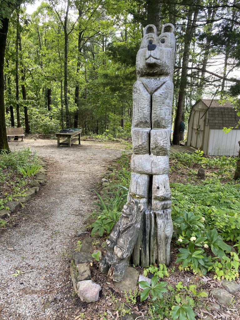 Fairfield Bay Wooden Bear Sculpture at Ed Leamon Park on the Garden Trail.